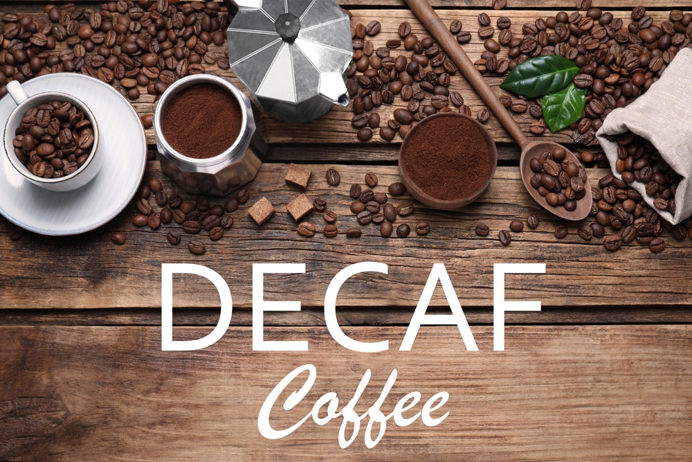 Flat,Lay,Composition,With,Decaf,Coffee,Beans,On,Wooden,Table Decaf Coffee